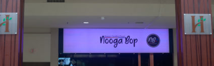 Nooga Bop's LED sign lit up purple in Hamilton Place Mall