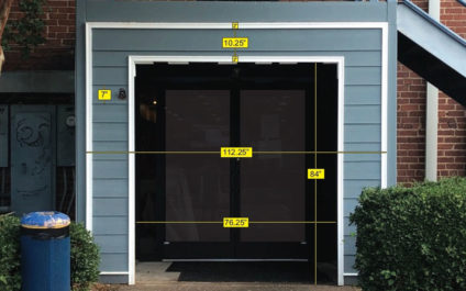 Front of River St. Deli restaurant in Chattanooga with measurements on the photo for the new neon sign