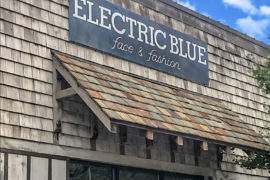 Electric Blue Collection facade with patina sign