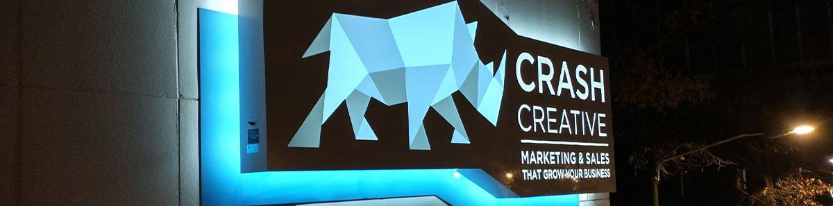 Crash Creative LED sign at night