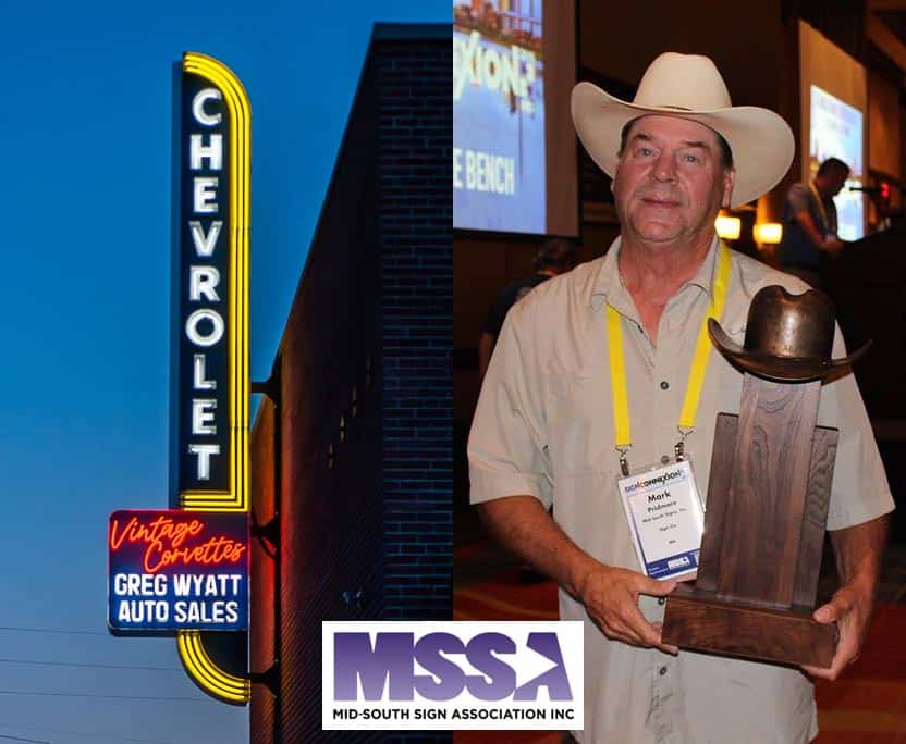 Neon sign for Greg Wyatts Auto Sales beside photo of Mark Pridmore holding statute at MSSA SignConnexion 2021