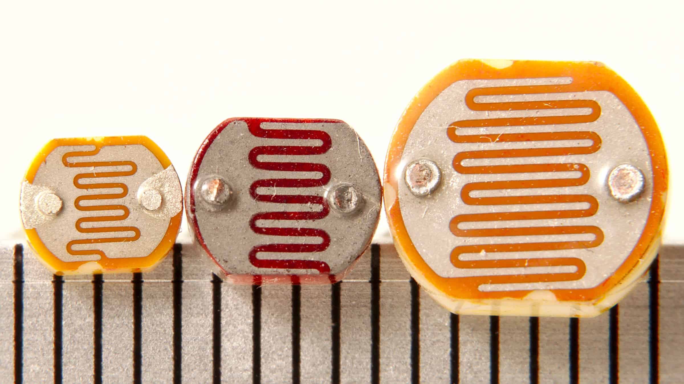 Three different sizes of photoresistors (aka photocells)