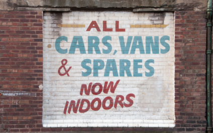 Painted Sign with writing All Cars, Vans, & Spares Now Indoors