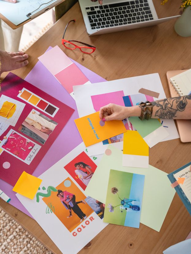 Brand strategy session with cut outs and colors on a desk