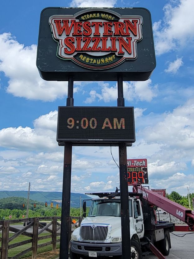 Western Sizzlin Pylon Sign service and repair by Ortwein Sign