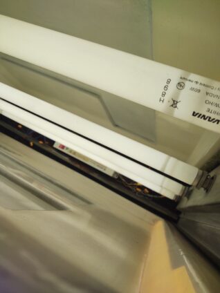 Interior of a sign with fluorescent bulbs